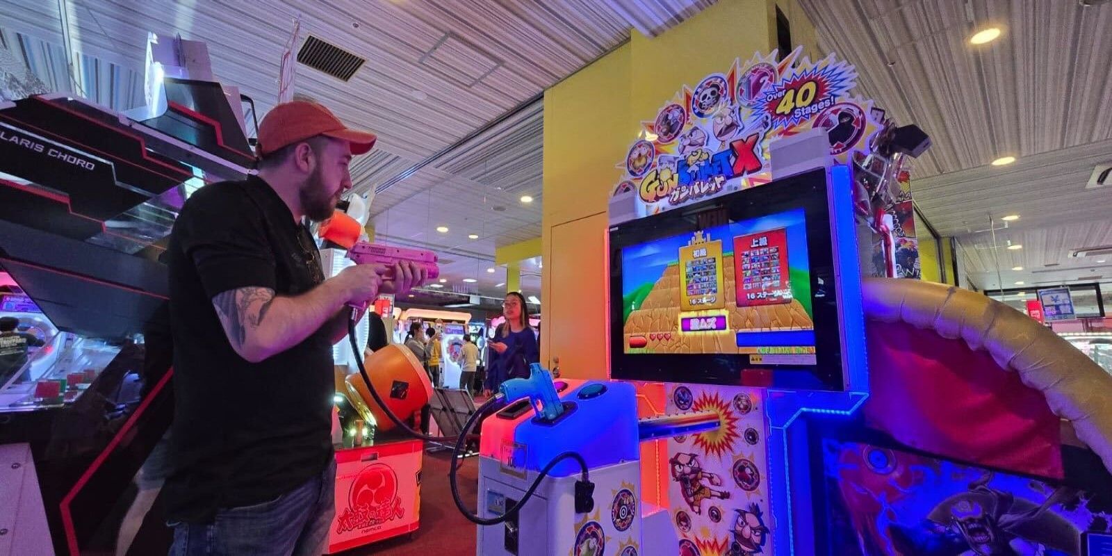 Me playing a Gun Bullet machine in a japanese arcade